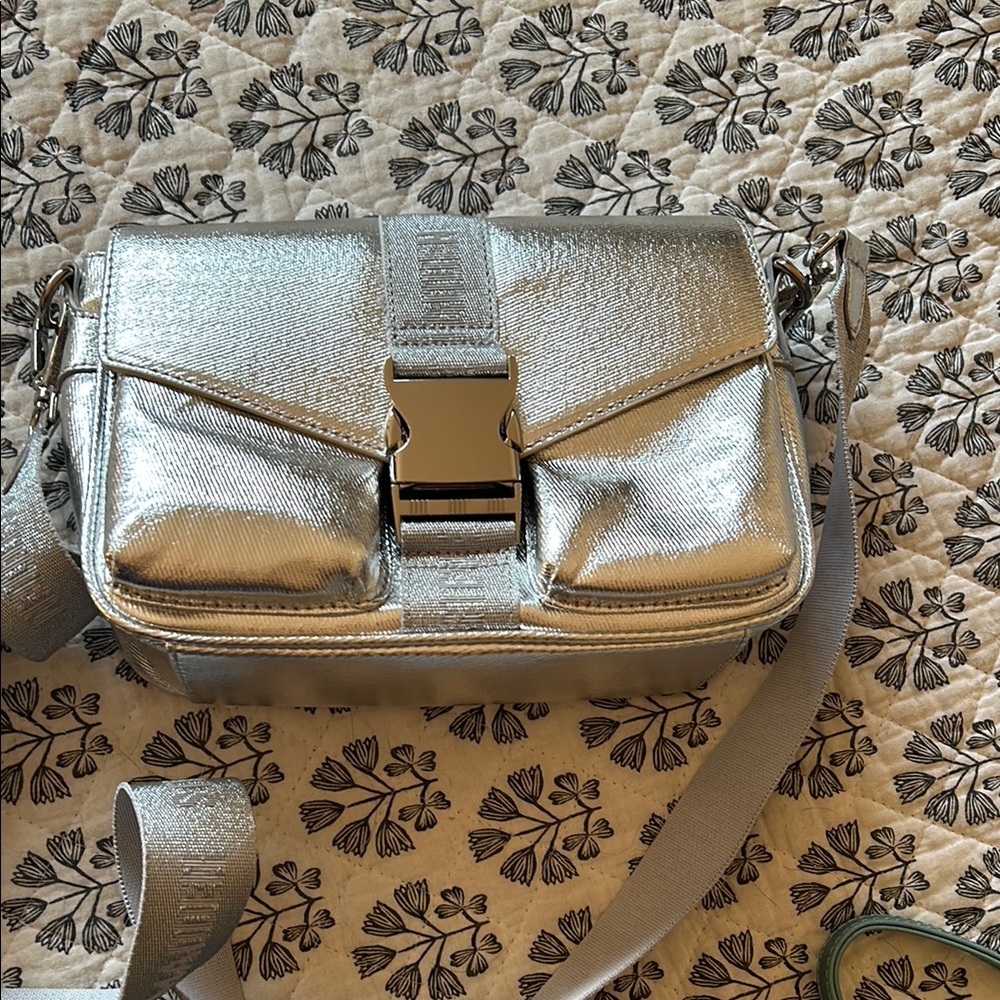 Silver Crossbody Bag with Metallic Finish and Large Clasp